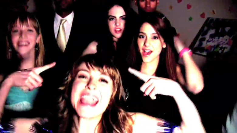 Ariana Grande and Elizabeth Gillies as Bat Mitzvah goers with other guests in The Battery's Down