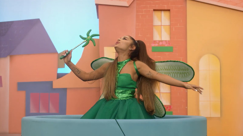 Ariana Grande as Piccola Grande, rising out of a hole on a children's TV set in Kidding