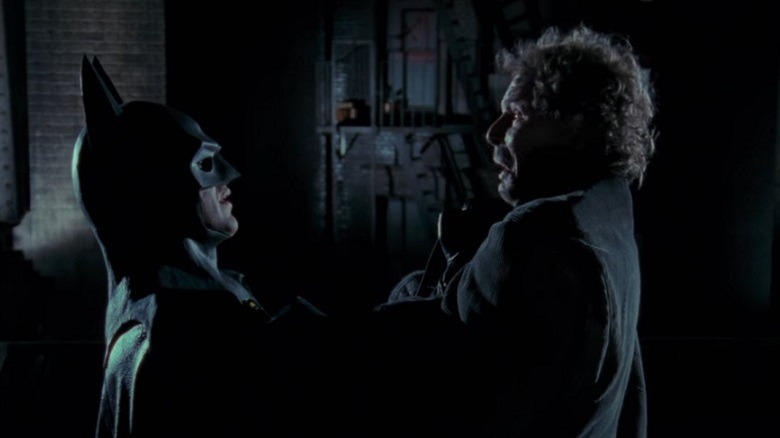 Batman hangs Nick from a roof, insisting that he - like a reverse Fight Club - tell all his friends about him. 