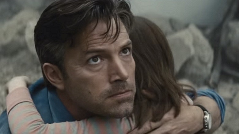 Ben Affleck comforts a survivor of the Kryptonian War