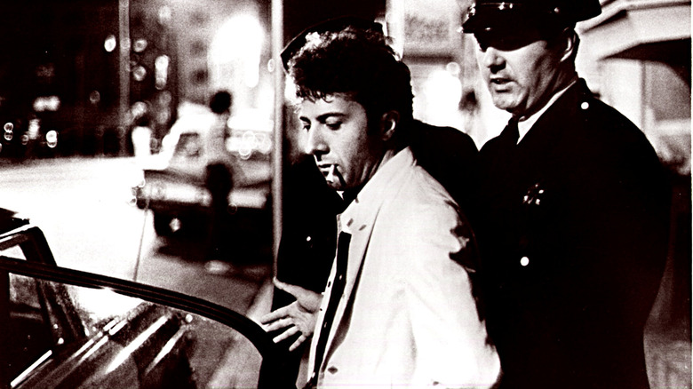 Dustin Hoffman as Lenny Bruce gets arrested