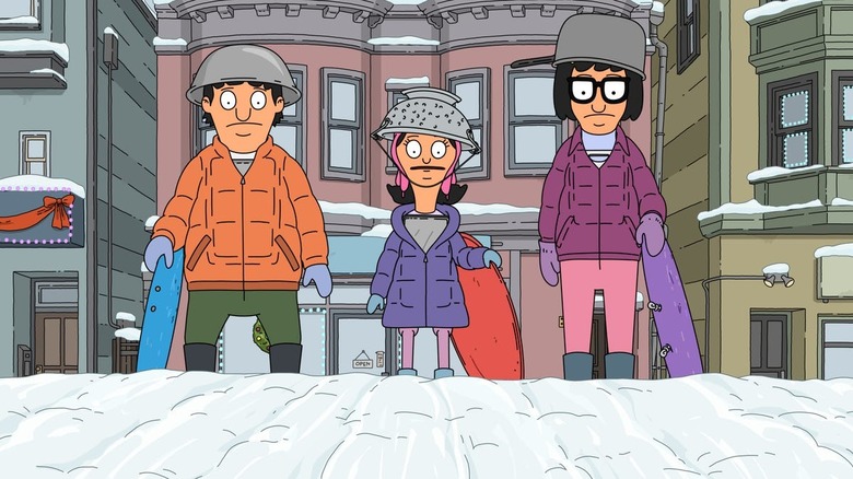 Gene, Louise, and Tina stand at the top of a snowy hill with cooking pots on their heads