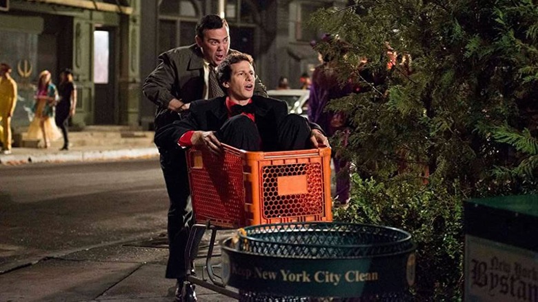 Charles Boyle pushes Jake Peralta in shopping cart