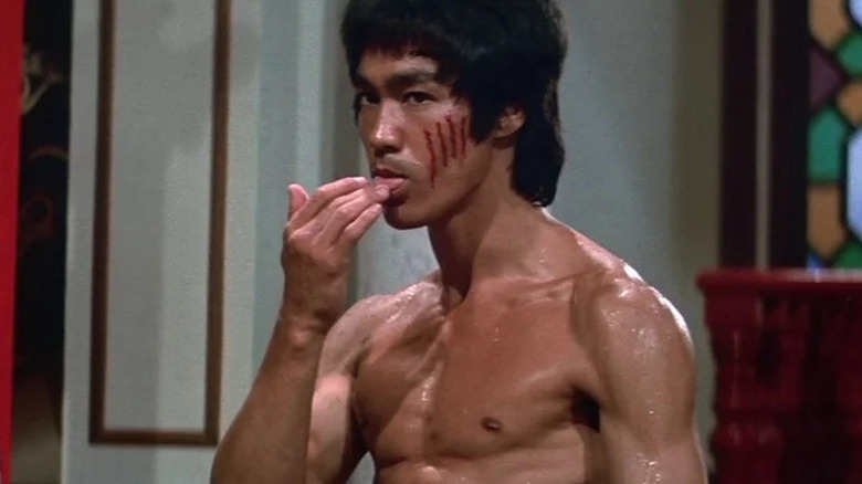 Bruce Lee's Lee tasting blood in Enter the Dragon