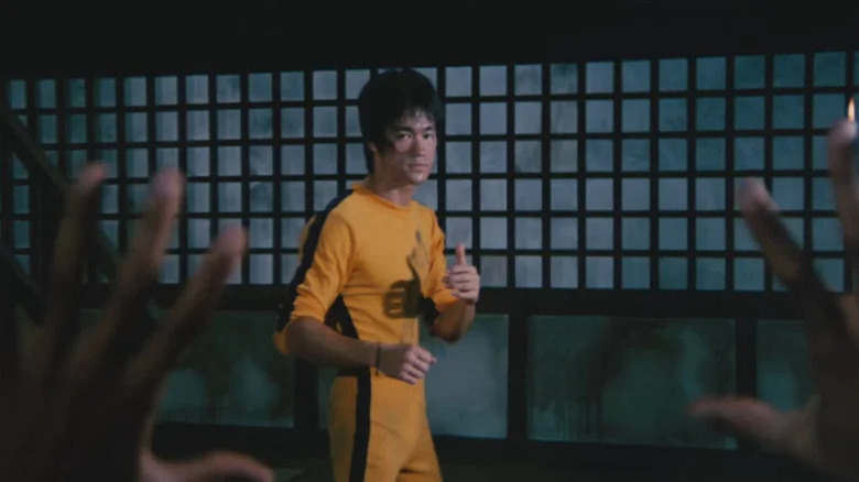 Bruce Lee's Billy Lo wearing a yellow jumpsuit in Game of Death