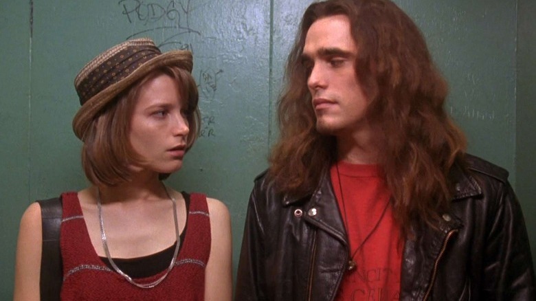 Bridget Fonda wearing hat, Matt Dillon with long hair and beard