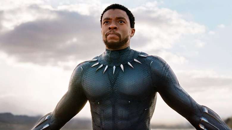 Chadwick Boseman as T'Challa, The Black Panther, walking toward his enemies with his chest high in 2018's Black Panther