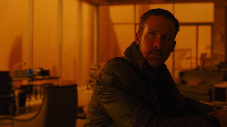 Ryan Gosling looks into distance as K in Blade Runner 2049