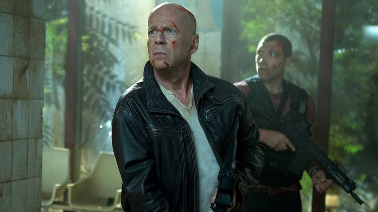 John and Jack McClane hold guns A Good Day to Die Hard