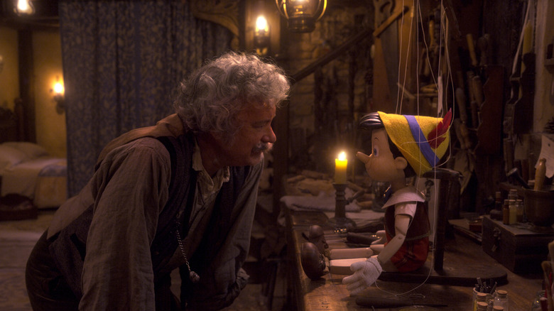 Geppetto (Tom Hanks) leaning towards Pinocchio