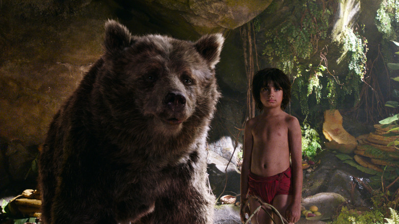 Mowgli (Neel Sethi) with Baloo in The Jungle Book