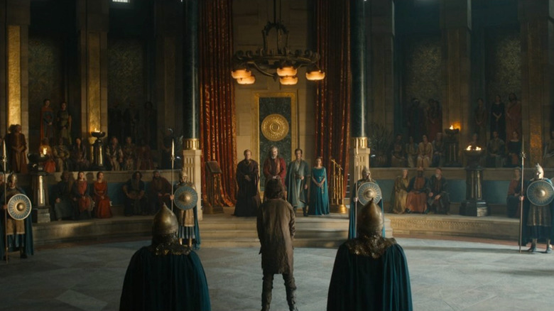 Elendil faces Ar-Pharazôn in throne room