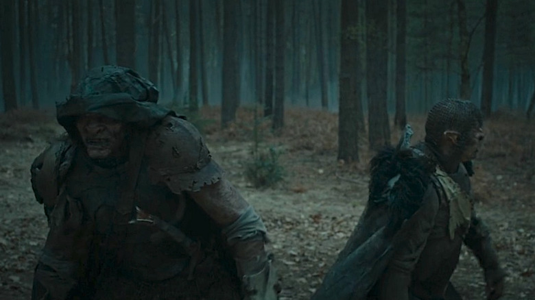 Two Orcs walk in woods