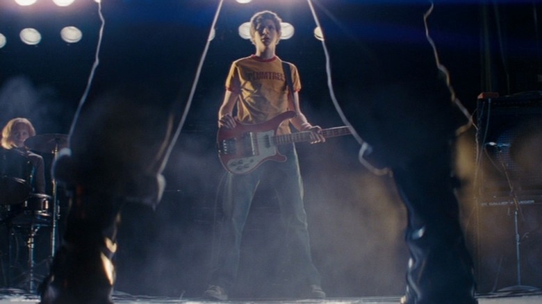Michael Cera as Scott Pilgrim with guitar