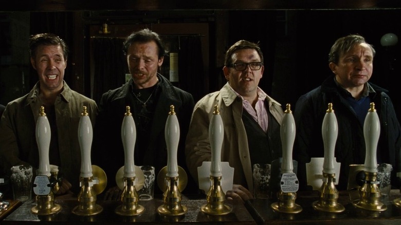 Group of friends with pints at bar in The World's End