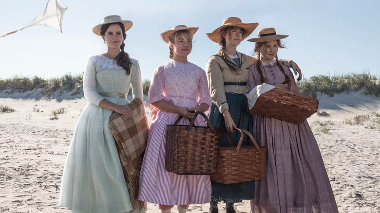 The four March sisters standing on the beach