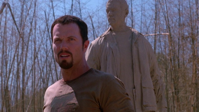 Adam Baldwin outside statue