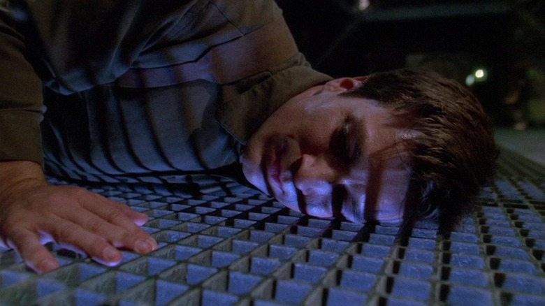 Nathan Fillion grate floor laying down