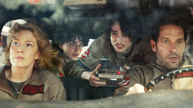 Spengler family and Grooberson driving Ecto-1 in Ghostbusters: Frozen Empire