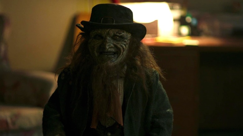 Linden Porco as the leprechaun, smiling at his next victim in Leprechaun Returns