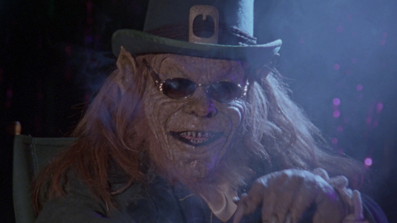 Lubdan the leprechaun wearing sunglasses, surrounded in smoke in Leprechaun in the Hood