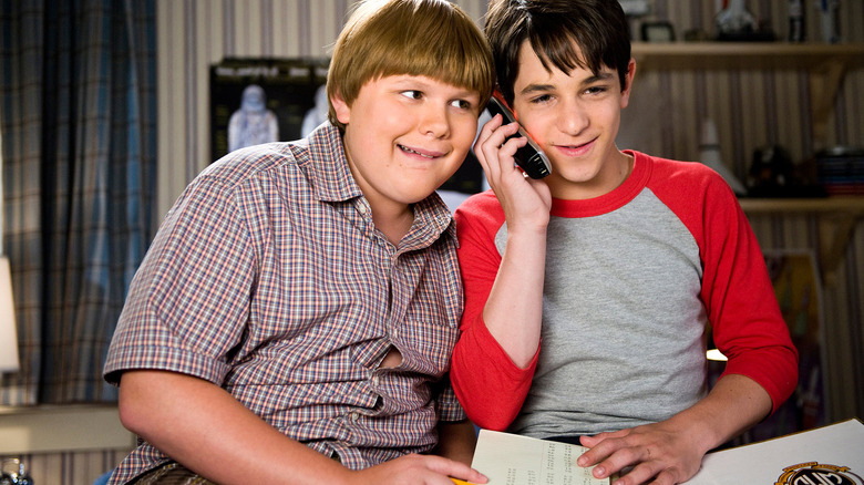 Robert Capron as Rowley Jefferson and Zachary Gordon as Greg Heffley give a prank call in 