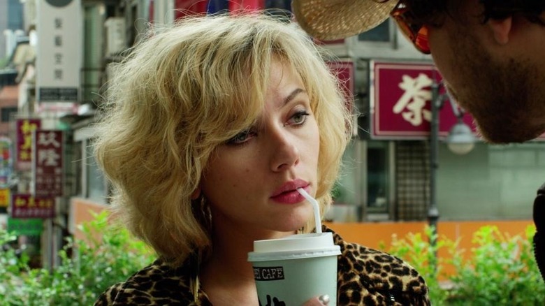 Scarlett Johansson sips drink LUCY