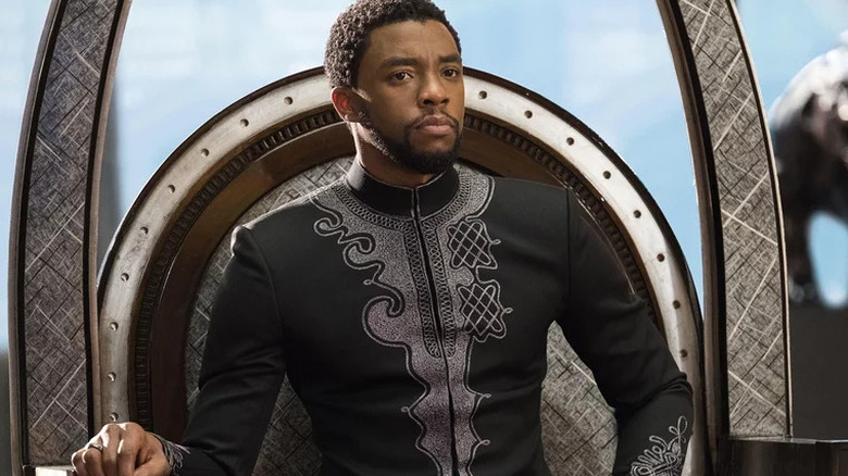 Chadwick Boseman sitting on throne Black Panther