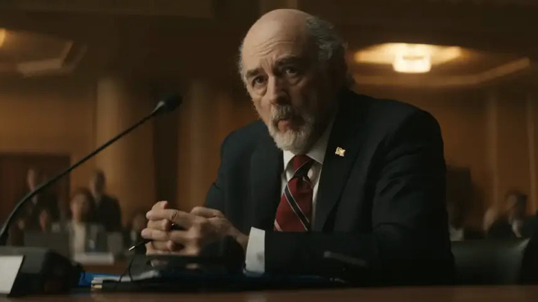 Richard Schiff sitting in Black Panther: Wakanda Forever