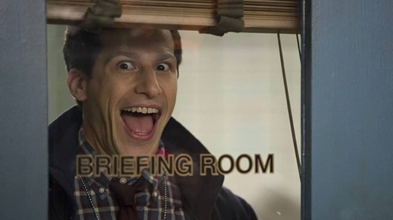 Andy Samberg briefing room smile 