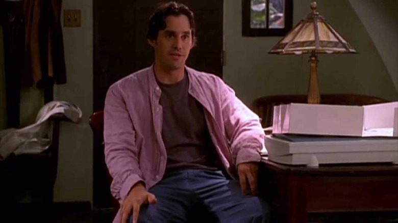 Buffy TVS' Xander sitting at desk 