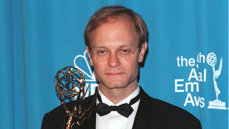 David Hyde Pierce smiing with Emmy in 1998