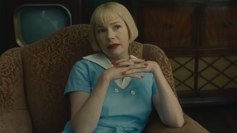 The Fabelmans' Michelle Williams hands crossed blue dress