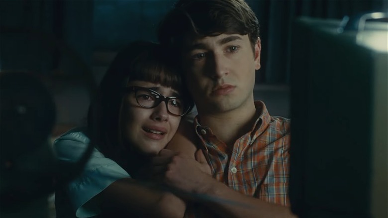 Julia Butters and Gabriel LaBelle hugging crying watching movie