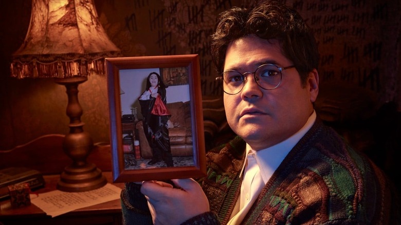 WWDITS' Guillermo holds photo of himself dressed as a vampire