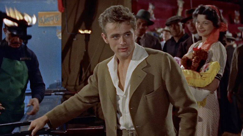 Cal with a small smile while wearing a brown suit in East of Eden