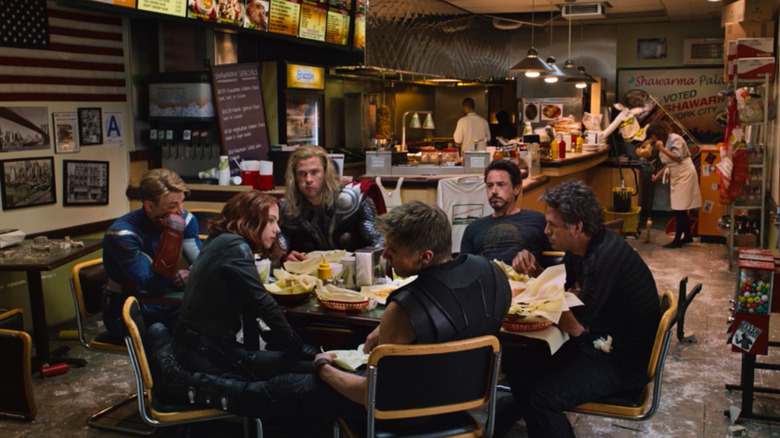 The six original Avengers sit at a round table eating schawarma.