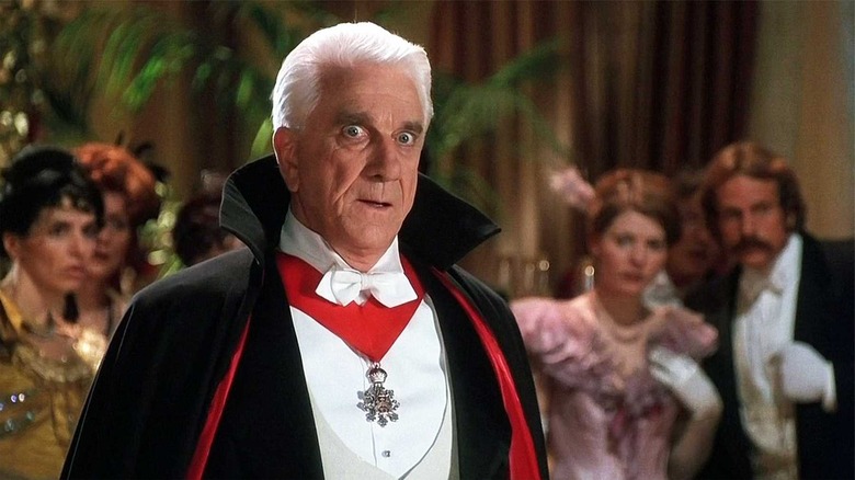 Leslie Nielsen looking uncomfortable at a gala