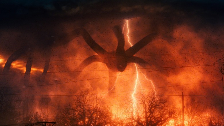 The Mind Flayer towers over electrical wires in Stranger Things