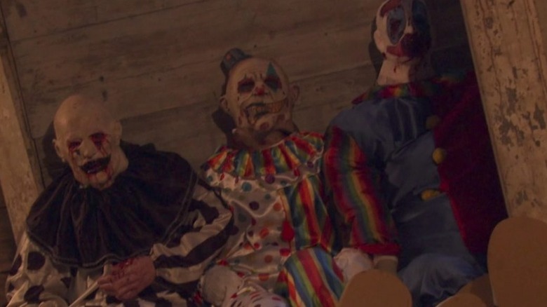 Hell House LLC's Clown dolls against wall