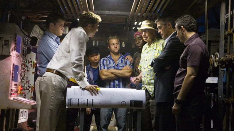 Rusty Linus Yen Basher Saul Danny and Livingston looking at plans in Ocean's 13