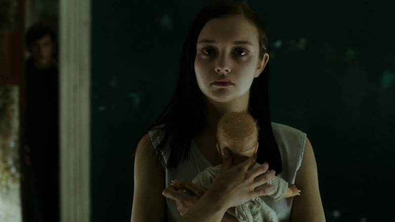 The Quiet One's Olivia Cooke holding doll