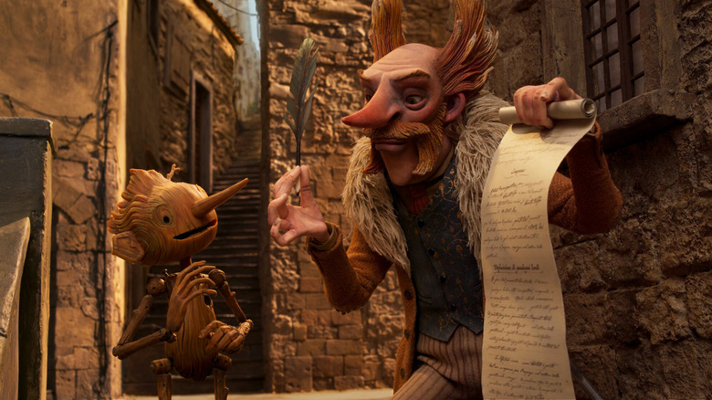 Count Volpe hands Pinocchio a feather pen to sign a contract in Guillermo del Toro's Pinocchio