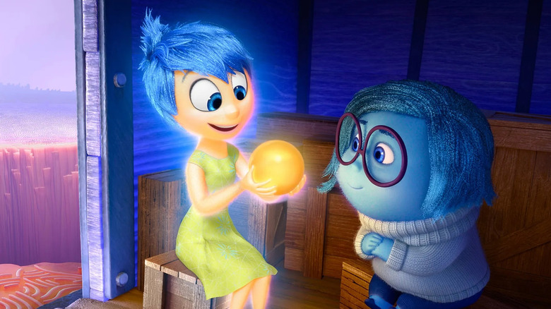 Joy and Sadness admire at a joyful core memory in Inside Out