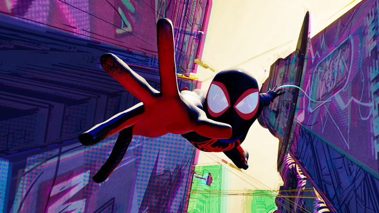 Miles Morales extends his hand out as he falls from a skyscraper in Spider-Man: Into the Spider-Verse