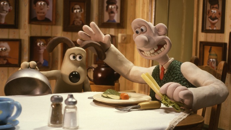 Wallace pats Gromit as he serves him vegetables in Wallace & Gromit: The Curse of the Were-Rabbit