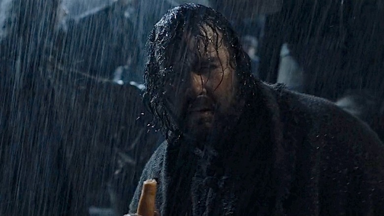 Albert Dreary eating a carrot in the rain in The Fellowship of the Ring