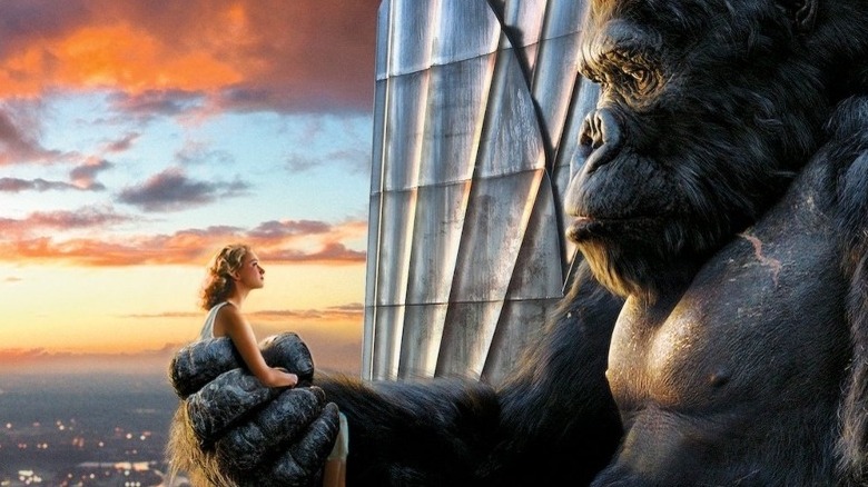 King Kong holds woman on top of building