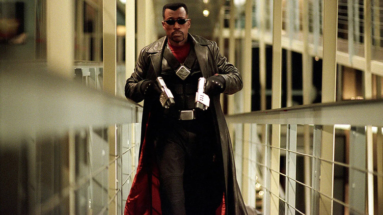 Wesley Snipes as Blade walking with futuristic pistols in Blade: Trinity