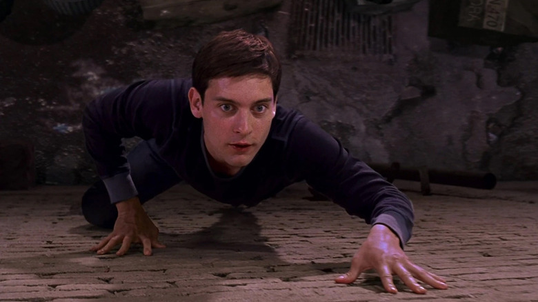 Peter Parker crawls up the wall for the first time in Spider-Man